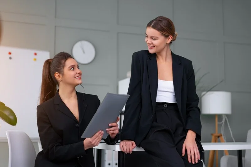 Finance Workers Holding Financial Statement